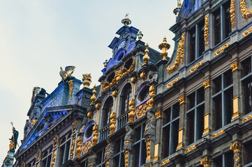 Grand Place, Grand Square or Grote Markt of Brussels, Belgium. Closeup Gold, statues and stone carvings on buildings.