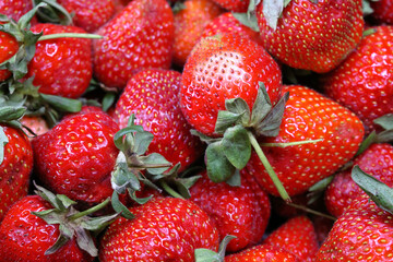 Juicy Fresh Red Strawberries In A Plastic Box On A Wooden Background..
