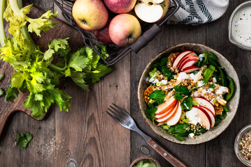 Traditional Waldorf salad on a wooden background