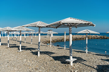 Beach umbrellas in the resort village of Nebug, Krasnodar Territory, Russia