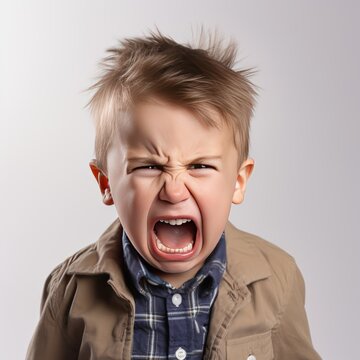 Angry Toddler Boy on White Background High Quality Images