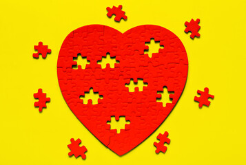 Red Heart Puzzle Unfinished on Yellow