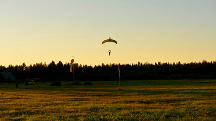 skydiving when there is sunset over the field