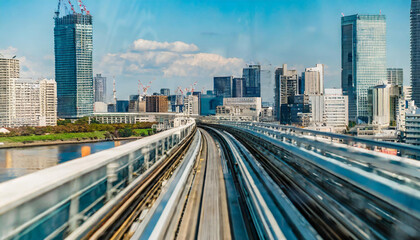 Abstract high speed technology POV motion blurred concept image from the Yuikamome monorail in Tokyo, Japan