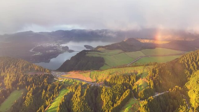 Aerial view blue lakes on green peaks, tropical island nature. Lagoa das Sete Cidades in the volcano crater. Ponta Delgada on Sao Miguel Island, Azores, Portugal