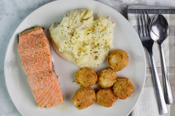 baked salmon  with scallops and mash potatoes