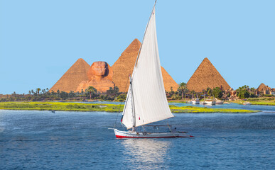 Beautiful Nile scenery with sailboat in the Nile on the way to The great Sphinx of Giza in Egypt  