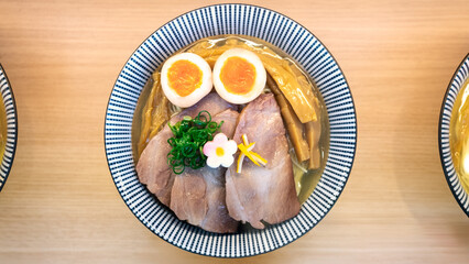 Artificial duplicates of Ramen and savory broth. Restaurant displays plastic
