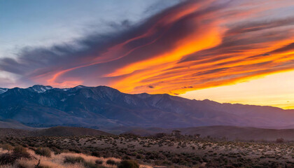 Beautiful Sierra Wave of California sunset with orange lenticular clouds burning in the sky - obrazy, fototapety, plakaty