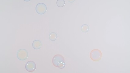 Soap bubbles on a pink background