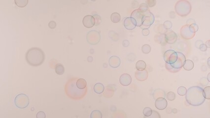 Soap bubbles on a pink background