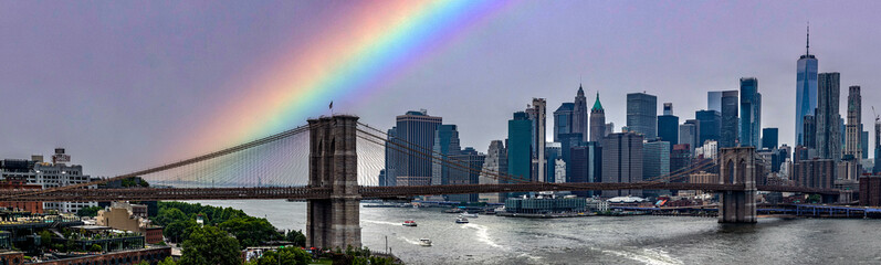 Panoramic view of the Brooklyn Bridge with the rainbow linking the boroughs of Manhattan and...