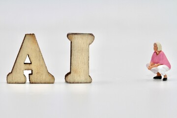 miniature figurine of people with artificial intelligence abbreviation