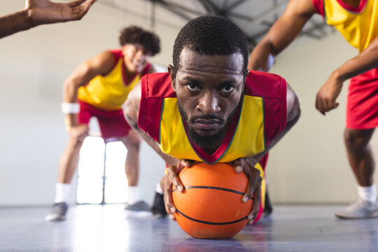Intense basketball game in an indoor court