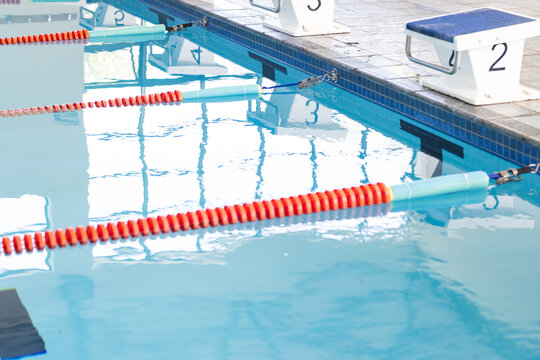 Swimming lanes await competitors at a clean indoor pool