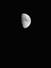 Half moon on dark sky at night