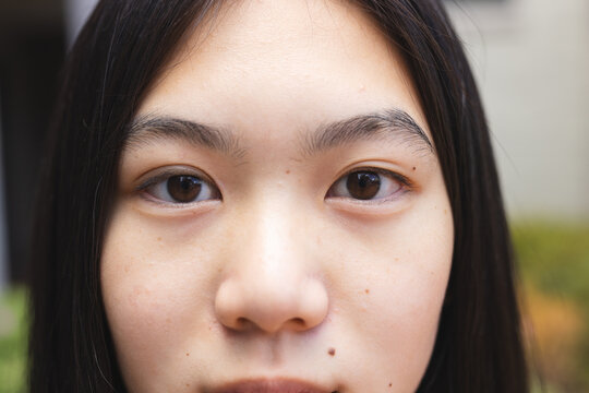 Close-up of a teenage Asian girl's face
