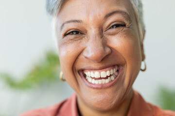 Close-up of a smiling biracial woman