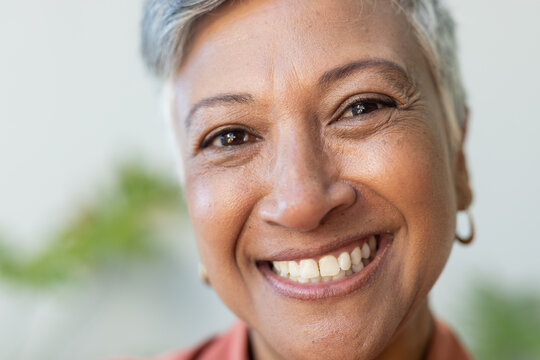 Close-up of a smiling biracial woman