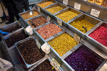 Olive shop selling green and black olives, a wide variety of pickled olive types,