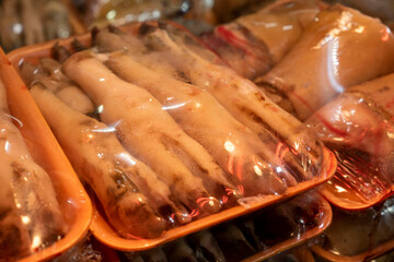 Sheep's feet, cleaned and prepared for making trotters at the butcher's shop,
