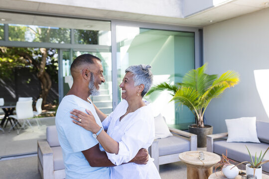 Senior biracial couple sharing a tender moment at home
