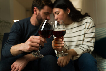 Boyfriend and girlfriend having a romantic date drinking wine