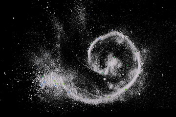 Washing white powder, detergent isolated on black background, top view