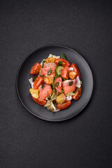 Delicious juicy salad with salmon, tomatoes, cucumber, herbs, pumpkin seeds