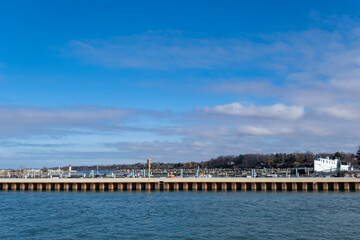 Fototapeta na wymiar View of empty port dock small city winter sunny day
