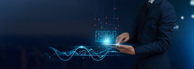 EIM: Businessman uses tablet on EIM icon global networking, Data Integration, Analytics,...