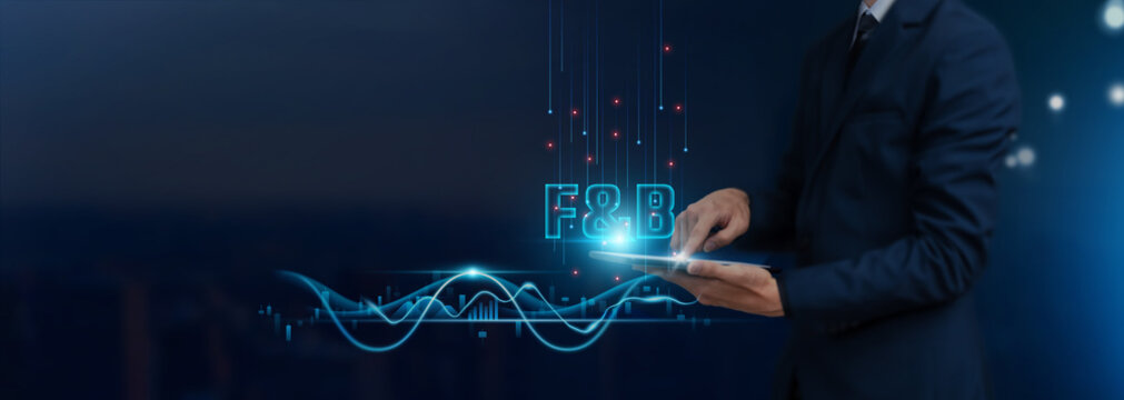 F and B - Food and Beverage Industry: Businessman uses tablet on Food and Beverage icon global networking, Analyzing Trends, Consumer Preferences, Developing Smart Solutions from Digital Technology.