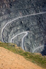a winding road in the middle of a mountain