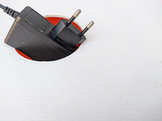 a black charger adapter in the corner