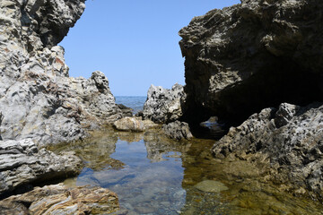 Beautiful seascape with a small creek and rocks (Mediterranean coast in France)