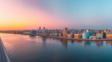  Panoramic view of the Havana skyline at sunset, pastel-colored buildings and the Malecón promenade, a timeless Cuban vista © Nii_Anna