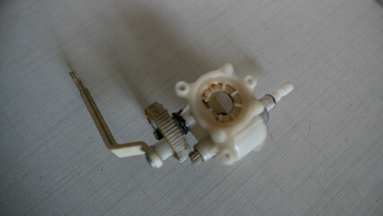 Small white fan with 4-blade propeller repair