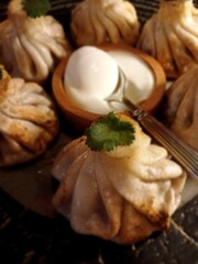 Fried khinkali with sour cream