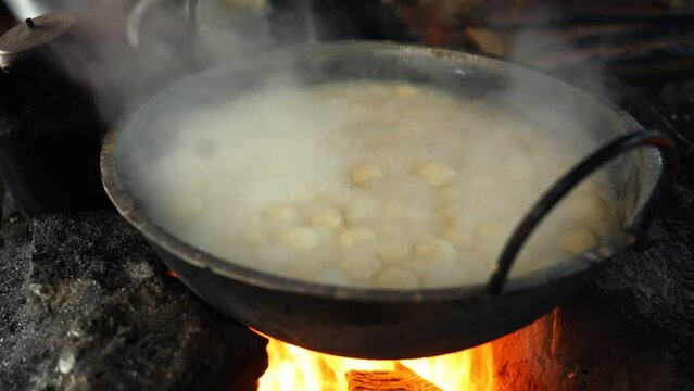 Art of making Rasgulla, a delightful Indian dessert made from milk solids, deep-fried to golden perfection and soaked in fragrant sugar syrup. Vibrant, aromatic, tempting. A feast for the senses