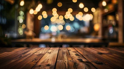 Fotobehang image of wooden table in front of resturant lights abstract blurred background © Jalal