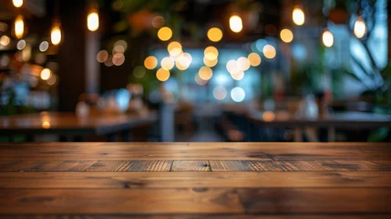 Keuken spatwand met foto image of wooden table in front of resturant lights abstract blurred background © Jalal