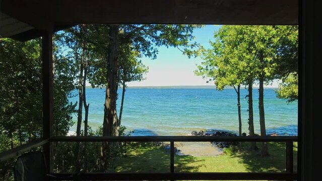View to the beautiful Lake Manitou from the cabin. Amazing sky line landscape with trees and water. Canadian wilderness. Perfect spot for a holiday. Cottage located on the largest fresh water island.