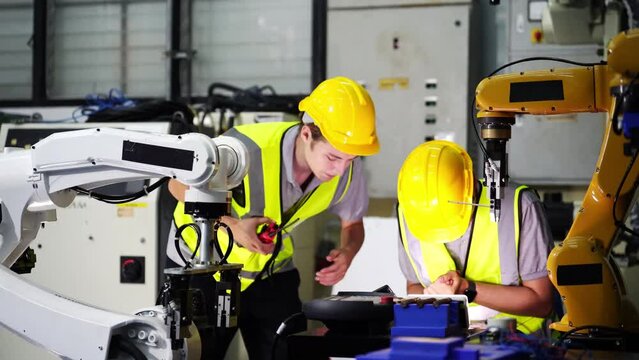 Technician working on robot arm repair its and get hurt in finger while working.