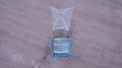 Aerial zenithal view of blue fishing hut in Saint Michel Chef Chef