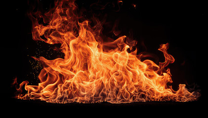  A large fire burns brightly flames are orange and yellow with blac background - obrazy, fototapety, plakaty