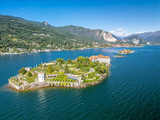 The drone aerial view of Borromean islands on Maggiore Lake and Stresa town, Italy. The Borromean Islands are a group of three small islands and Isola Bella.