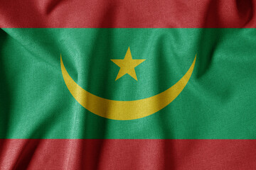 National Flag on Textured Fabric Background. Silk textured flag, realistic wave and flag look. MR  Flag of Mauritania
