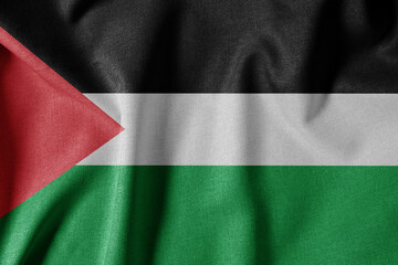 Obraz premium National Flag on Textured Fabric Background. Silk textured flag, realistic wave and flag look. PS Flag of Palestine