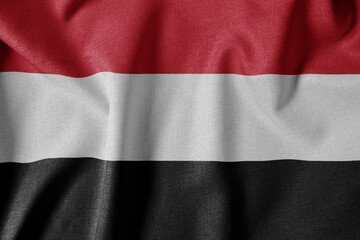 National Flag on Textured Fabric Background. Silk textured flag, realistic wave and flag look. YE  Flag of Yemen