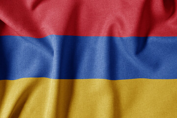 National Flag on Textured Fabric Background. Silk textured flag, realistic wave and flag look. AM  Flag of Armenia